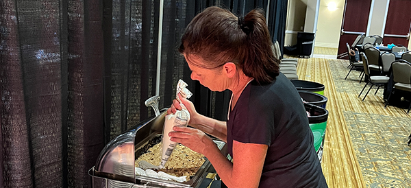 Executive Chef Lisa Murphy Jones of the Paducah Convention Center ices a cobbler for an event in the Summer of 2022.